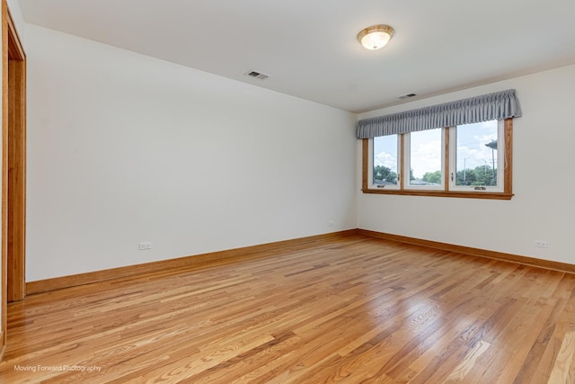 1773 W Whispering Ct, Addison, IL 60101 - unfurnished room featuring light wood finished floors and baseboards