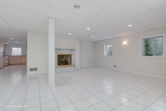 1773 W Whispering Ct, Addison, IL 60101 - unfurnished living room featuring a paneled ceiling, a fireplace, light tile patterned floors, and recessed lighting