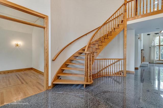 1773 W Whispering Ct, Addison, IL 60101 - staircase featuring granite tiled floors and a towering ceiling