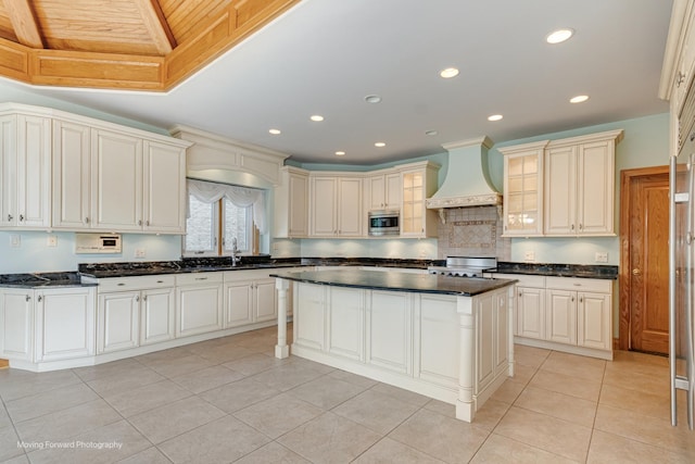 1773 W Whispering Ct, Addison, IL 60101 - kitchen featuring custom range hood, stove, recessed lighting, light tile patterned flooring, and a kitchen island