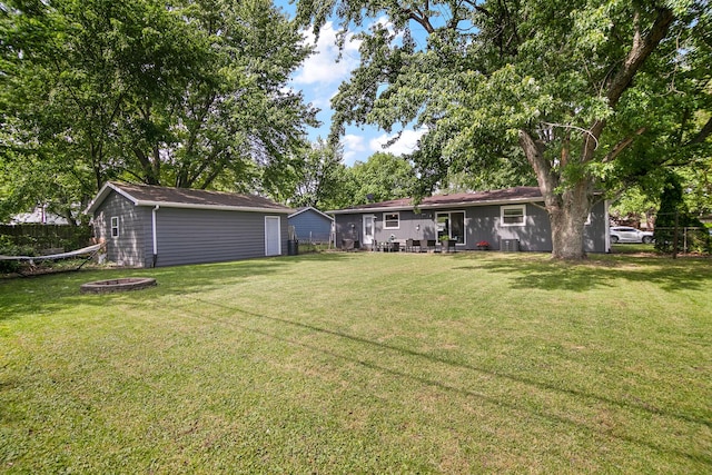 1274 Theresa Ln, Bourbonnais, IL 60914 - view of yard with an outbuilding, an outdoor fire pit, and central AC unit