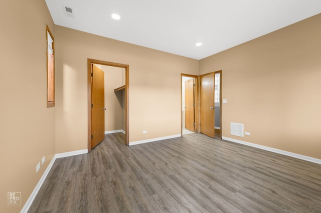 2711 W Congress Pkwy Unit 1, Chicago, IL 60612 - unfurnished room with wood finished floors, baseboards, and recessed lighting