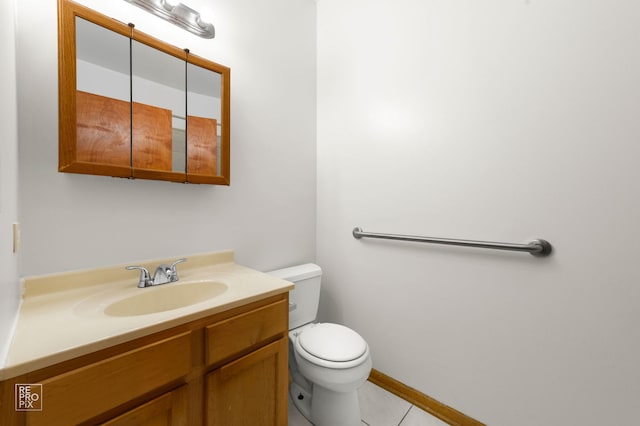 2711 W Congress Pkwy Unit 1, Chicago, IL 60612 - bathroom with toilet, vanity, tile patterned flooring, and baseboards