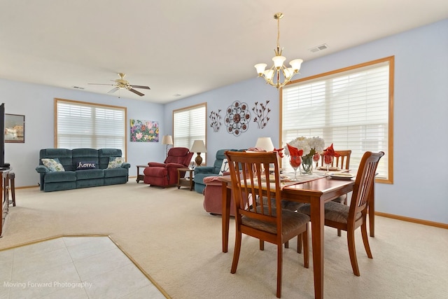 17016 Delevan St, Lockport, IL 60441 - dining area with light carpet, a chandelier, a ceiling fan, and baseboards