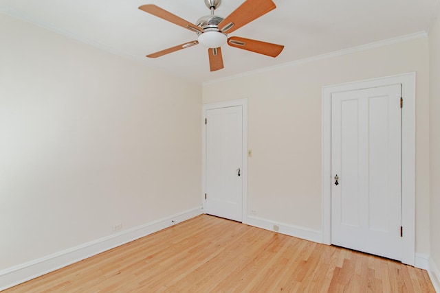 1929 Sherman Ave Unit 2E, Evanston, IL 60201 - unfurnished bedroom featuring wood finished floors, ornamental molding, baseboards, and a ceiling fan