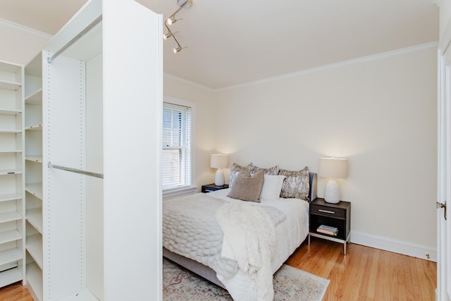 1929 Sherman Ave Unit 2E, Evanston, IL 60201 - bedroom featuring wood finished floors, crown molding, and baseboards