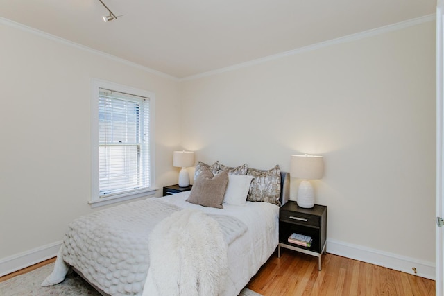 1929 Sherman Ave Unit 2E, Evanston, IL 60201 - bedroom featuring wood finished floors, baseboards, and ornamental molding