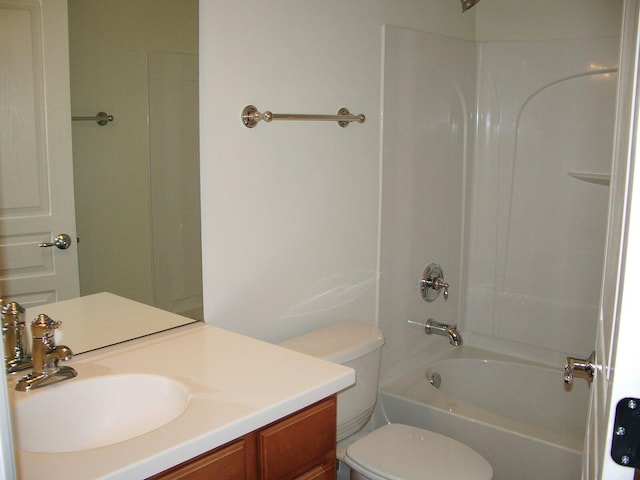 bathroom featuring toilet, bathtub / shower combination, and vanity