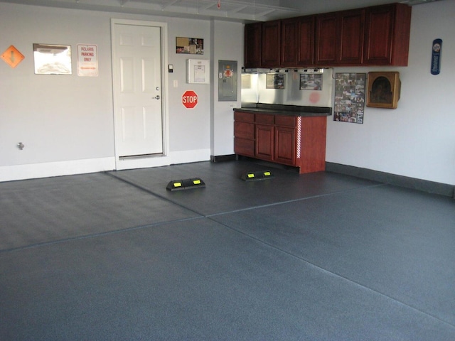 garage featuring baseboards