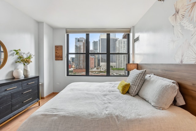 330 N Jefferson St Unit 1002, Chicago, IL 60661 - bedroom with light wood finished floors and a view of city