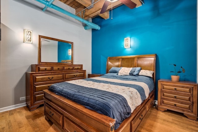 225 W Huron St Unit 413, Chicago, IL 60654 - bedroom with beamed ceiling, wood finished floors, ceiling fan, and baseboards