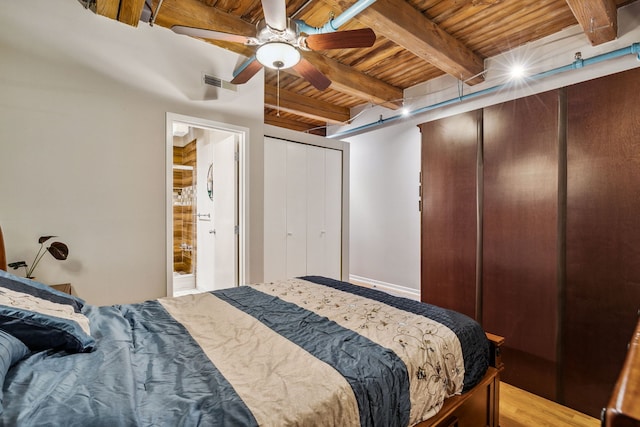 225 W Huron St Unit 413, Chicago, IL 60654 - bedroom with wooden ceiling with exposed beams, a ceiling fan, ensuite bathroom, and multiple closets