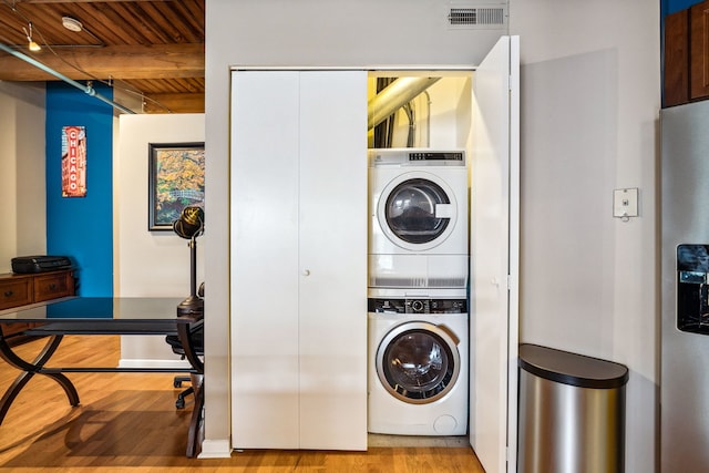 225 W Huron St Unit 413, Chicago, IL 60654 - laundry room featuring stacked washer and clothes dryer, wooden ceiling, and wood finished floors