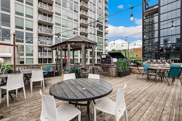 225 W Huron St Unit 413, Chicago, IL 60654 - wooden deck featuring outdoor dining area