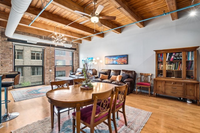 225 W Huron St Unit 413, Chicago, IL 60654 - dining room featuring wooden ceiling with exposed beams, wood finished floors, ceiling fan, and a chandelier