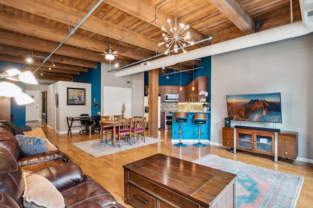 225 W Huron St Unit 413, Chicago, IL 60654 - living room featuring wood ceiling with exposed beams, a ceiling fan, a chandelier, wood finished floors, and baseboards