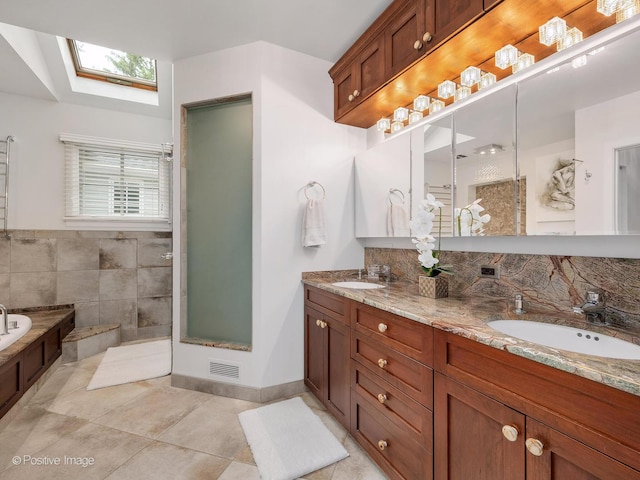 5951 S Grant St, Burr Ridge, IL 60527 - bathroom featuring a skylight, tile patterned flooring, double vanity, a garden tub, and a shower