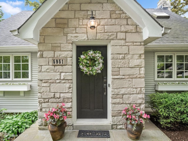 5951 S Grant St, Burr Ridge, IL 60527 - property entrance with stone siding and roof with shingles