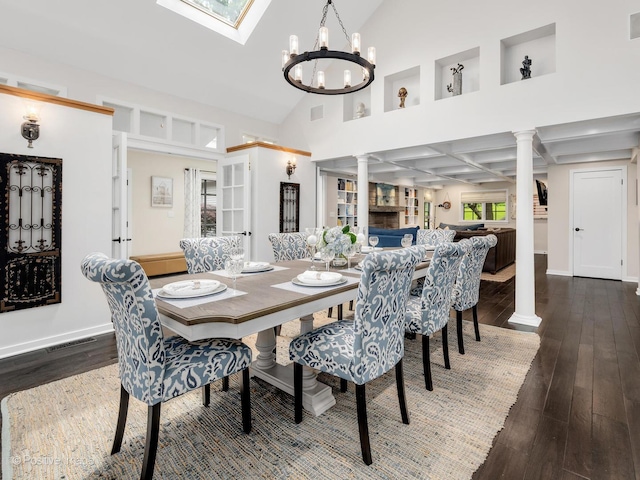 5951 S Grant St, Burr Ridge, IL 60527 - dining room featuring hardwood / wood-style flooring, a chandelier, decorative columns, and high vaulted ceiling