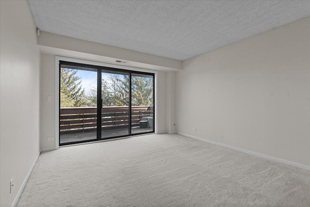 706 Waukegan Rd Unit 403C, Glenview, IL 60025 - unfurnished room with carpet flooring, a textured ceiling, and baseboards