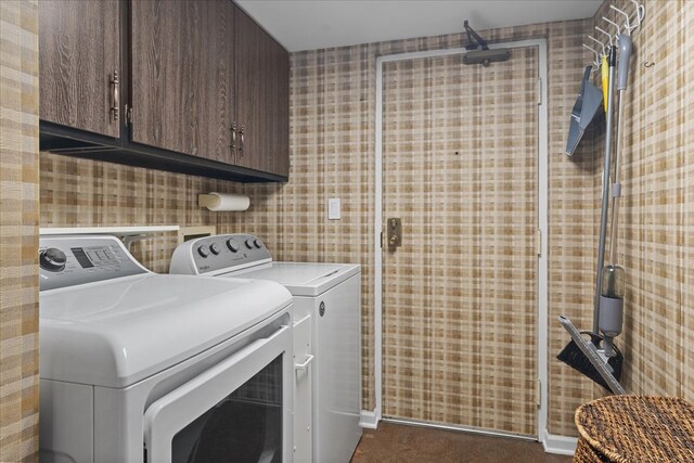 706 Waukegan Rd Unit 403C, Glenview, IL 60025 - laundry room featuring washing machine and dryer, cabinet space, and wallpapered walls