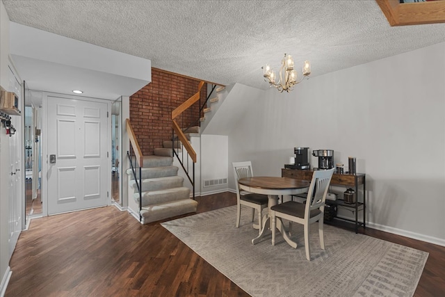 706 Waukegan Rd Unit 403C, Glenview, IL 60025 - dining space with wood finished floors, stairs, baseboards, a textured ceiling, and a chandelier