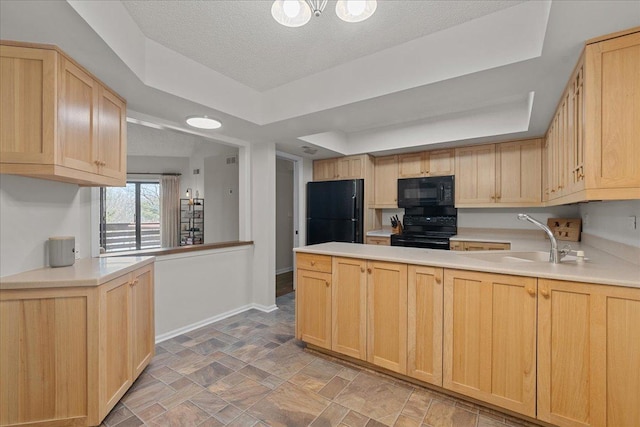 706 Waukegan Rd Unit 403C, Glenview, IL 60025 - kitchen with black appliances, light brown cabinets, and a textured ceiling