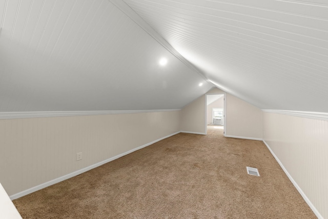 1028 5th St, Aurora, IL 60505 - bonus room with carpet flooring, vaulted ceiling, and baseboards