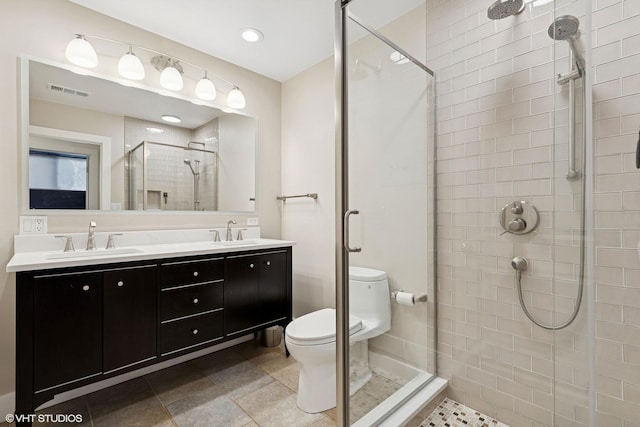 137 Hiawatha Trl, Highland Park, IL 60035 - full bathroom featuring toilet, a stall shower, double vanity, and recessed lighting