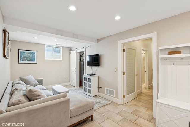 137 Hiawatha Trl, Highland Park, IL 60035 - living area featuring a barn door, recessed lighting, baseboards, and light stone finish flooring