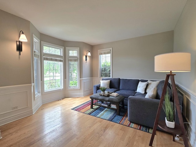 501 Siesta Dr, New Lenox, IL 60451 - living area featuring plenty of natural light, wood finished floors, a decorative wall, and wainscoting