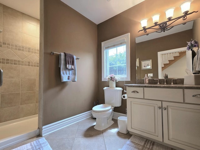 501 Siesta Dr, New Lenox, IL 60451 - bathroom featuring toilet, vanity, baseboards, a tile shower, and tile patterned floors