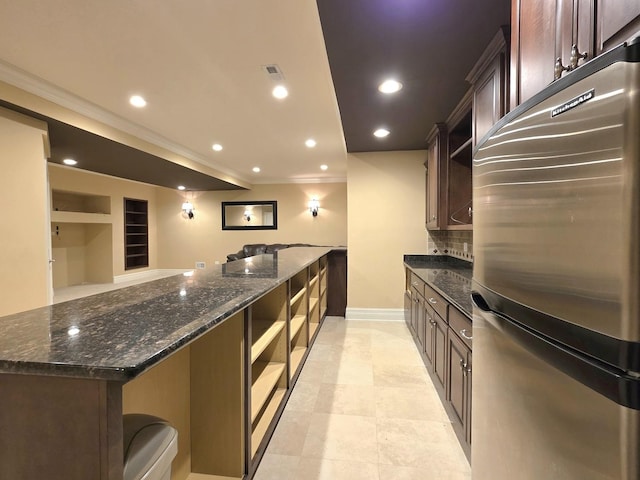501 Siesta Dr, New Lenox, IL 60451 - kitchen with freestanding refrigerator, open shelves, crown molding, dark stone countertops, and tasteful backsplash
