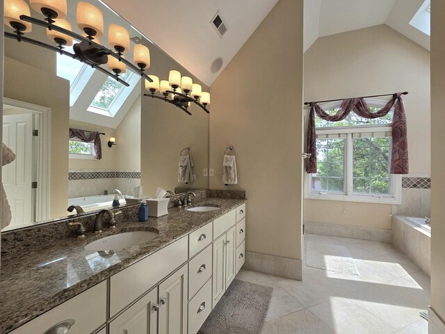 501 Siesta Dr, New Lenox, IL 60451 - bathroom featuring a skylight, high vaulted ceiling, a bath, double vanity, and tile patterned floors