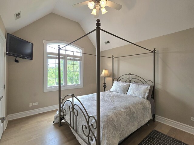 501 Siesta Dr, New Lenox, IL 60451 - bedroom with lofted ceiling, wood finished floors, baseboards, and a ceiling fan