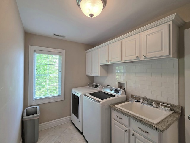 501 Siesta Dr, New Lenox, IL 60451 - laundry room featuring separate washer and dryer, cabinet space, light marble finish floors, and baseboards