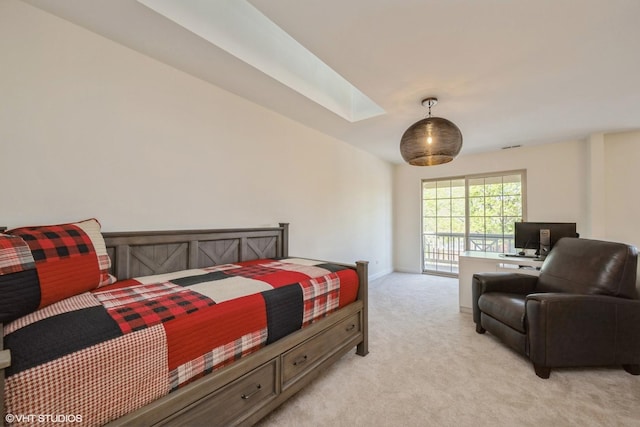 6247 Lincoln Ave Unit 6-3, Morton Grove, IL 60053 - bedroom with a skylight, light colored carpet, a desk, access to exterior, and baseboards