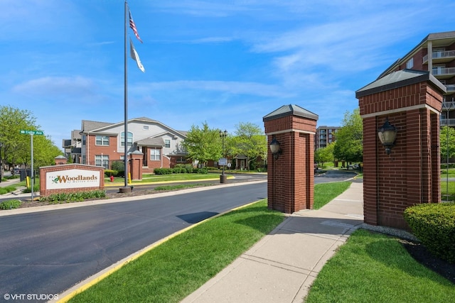 6247 Lincoln Ave Unit 6-3, Morton Grove, IL 60053 - view of asphalt road featuring sidewalks, street lights, a residential view, and curbs