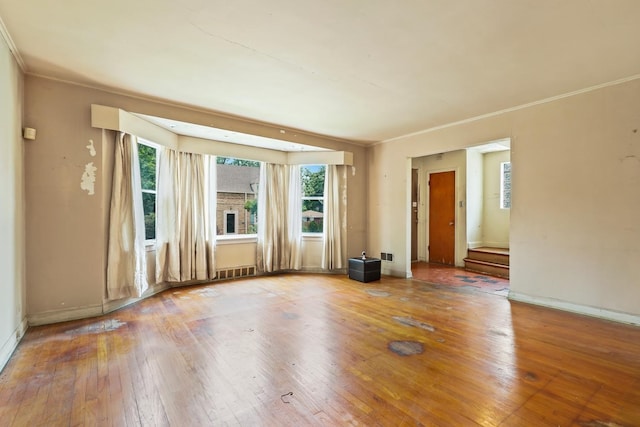 1571 W 100th Pl, Chicago, IL 60643 - empty room with plenty of natural light, wood-type flooring, crown molding, and baseboards