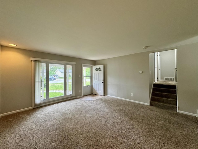 824 Dartmouth Ave, Matteson, IL 60443 - unfurnished living room featuring carpet, baseboards, and stairway