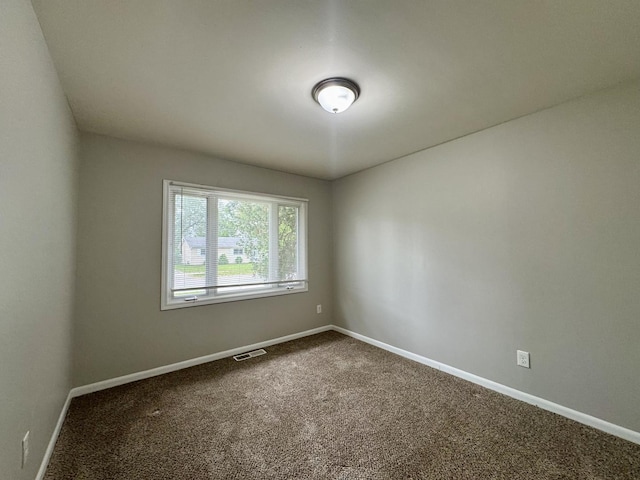 824 Dartmouth Ave, Matteson, IL 60443 - unfurnished room with dark colored carpet and baseboards