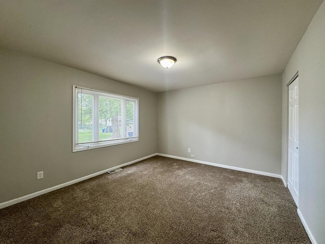 824 Dartmouth Ave, Matteson, IL 60443 - unfurnished room featuring dark carpet and baseboards