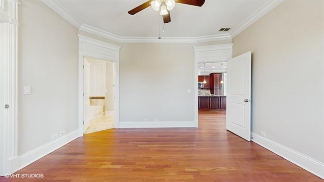 2540 W Diversey Ave Unit 404, Chicago, IL 60647 - unfurnished room with a ceiling fan, ornamental molding, light wood-style flooring, and baseboards