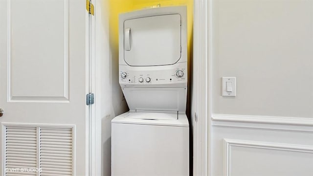 2540 W Diversey Ave Unit 404, Chicago, IL 60647 - washroom featuring stacked washer / dryer