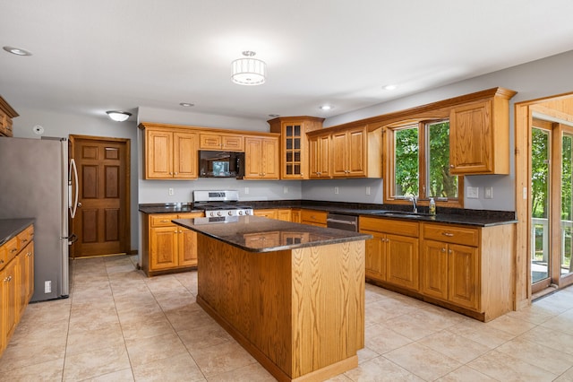 2946 County Road 800 E, Dewey, IL 61840 - kitchen featuring appliances with stainless steel finishes, a sink, brown cabinetry, a kitchen island, and recessed lighting