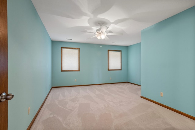 2946 County Road 800 E, Dewey, IL 61840 - spare room with light carpet, baseboards, and a ceiling fan