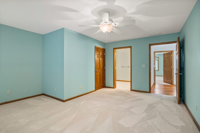 2946 County Road 800 E, Dewey, IL 61840 - unfurnished bedroom featuring light colored carpet, baseboards, and ceiling fan