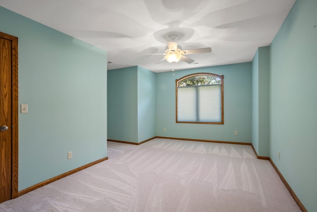 2946 County Road 800 E, Dewey, IL 61840 - unfurnished room featuring light carpet, a ceiling fan, and baseboards