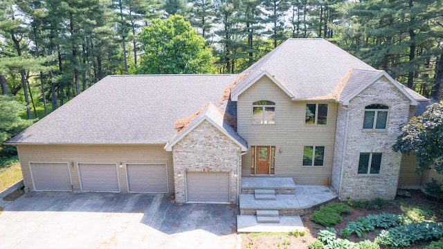 2946 County Road 800 E, Dewey, IL 61840 - view of front facade with asphalt driveway, brick siding, and an attached garage