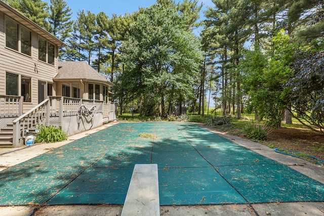 2946 County Road 800 E, Dewey, IL 61840 - view of pool with a diving board, a wooden deck, and a covered pool